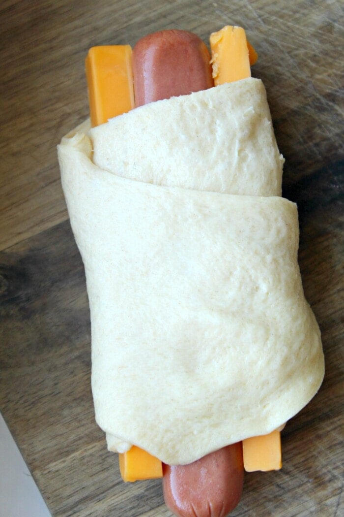 hot dogs wrapped in pizza dough and cheese