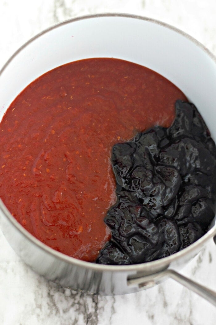 chili sauce and grape jelly in a saucepan