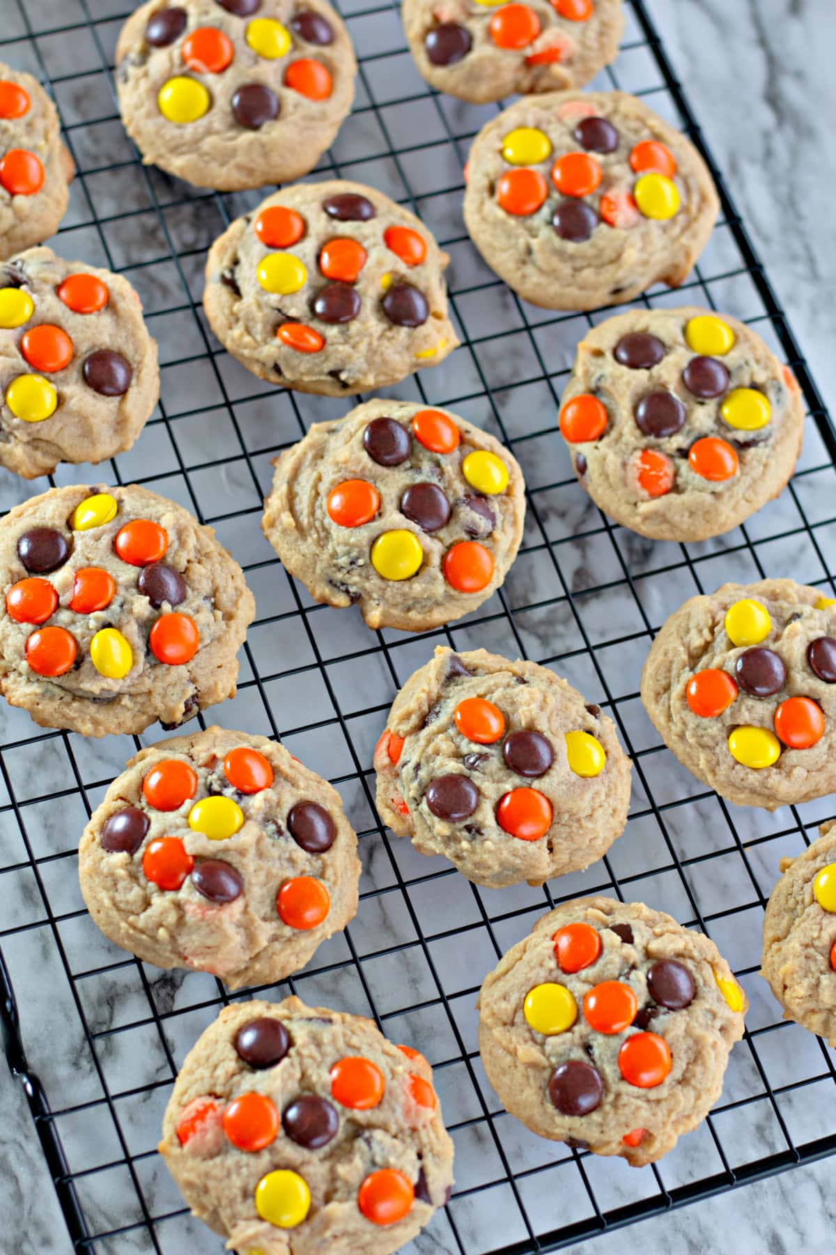 Reese's Pieces Cookies on a cooling rack