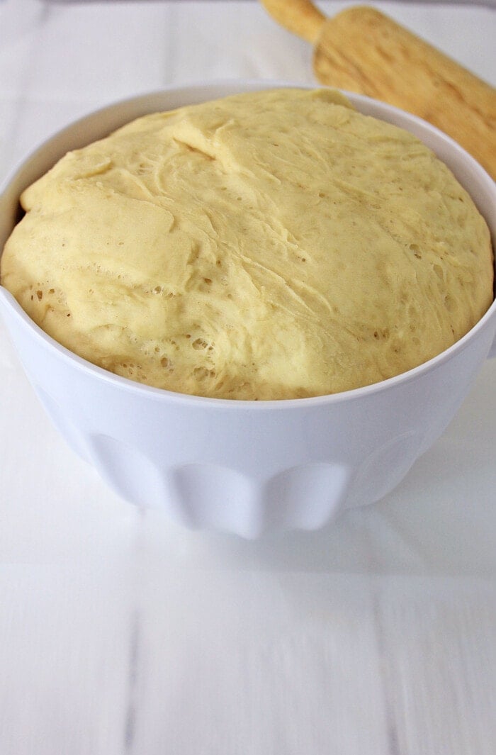 bread dough in a bowl rising