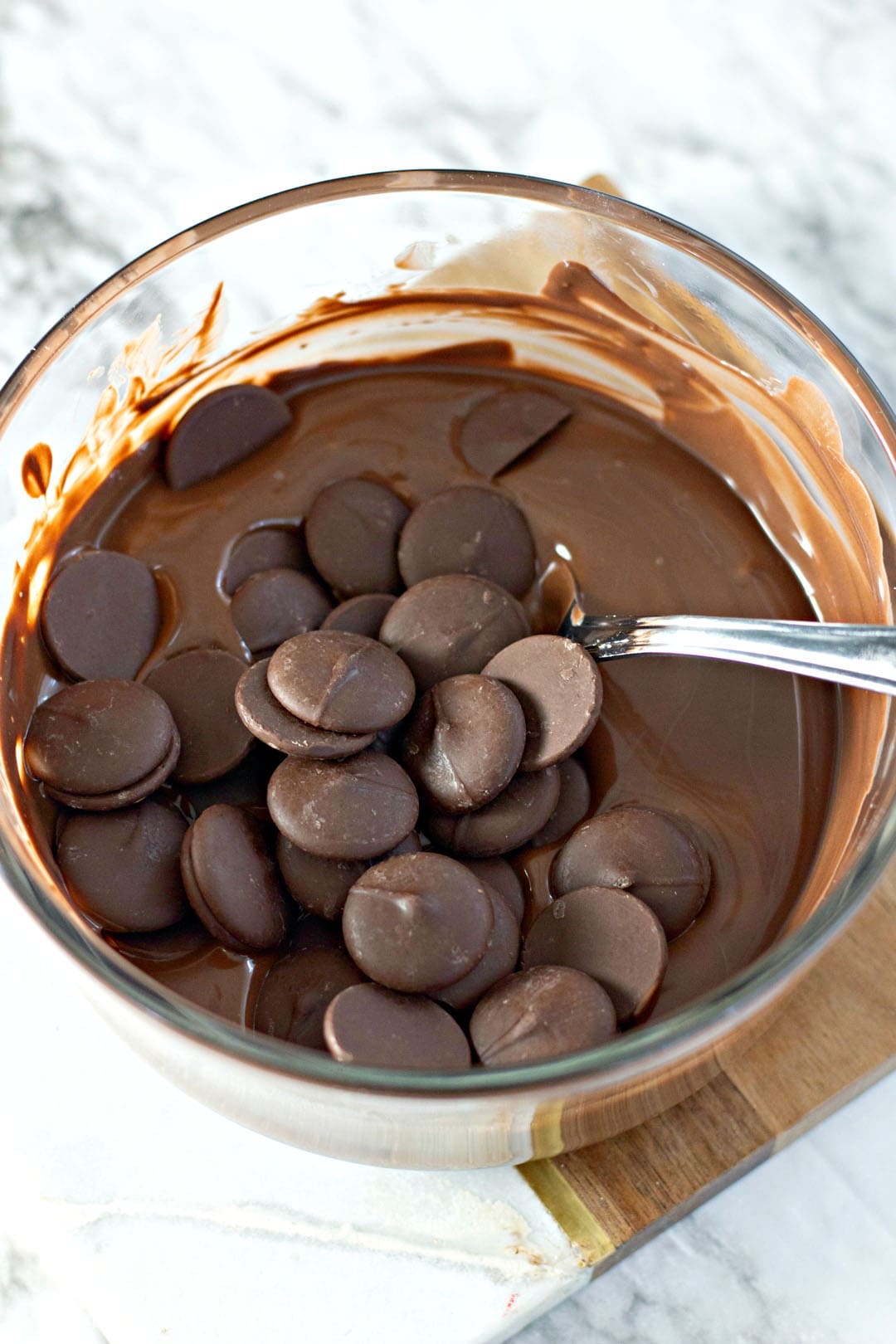 melting dark chocolate in a clear bowl