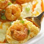 Cajun Shrimp and Grits is a simple recipe with buttery homemade grits with spicy seasoned shrimp on top.