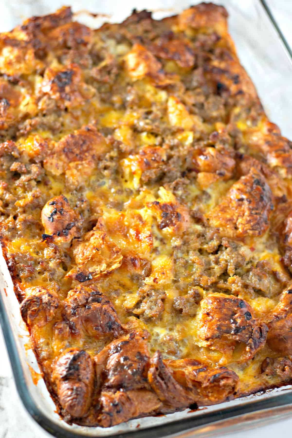 Overhead view of croissant breakfast casserole in a baking dish