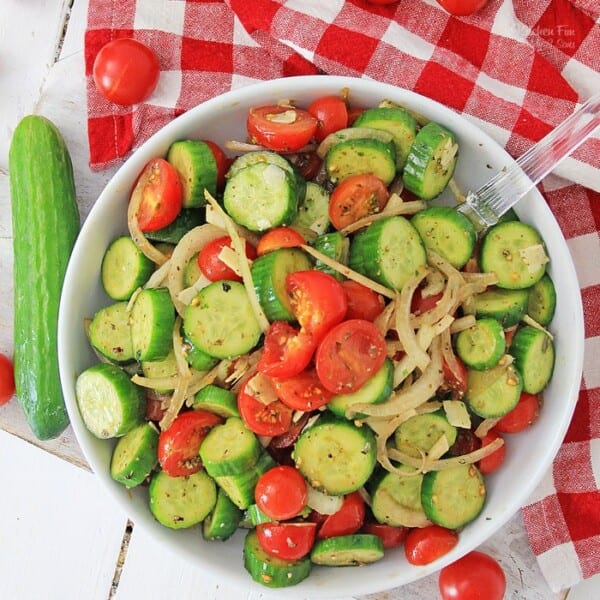 Cucumber Tomato Salad is a simple summer side dish loaded with flavor and healthy veggies. It's topped with an easy homemade Italian dressing.