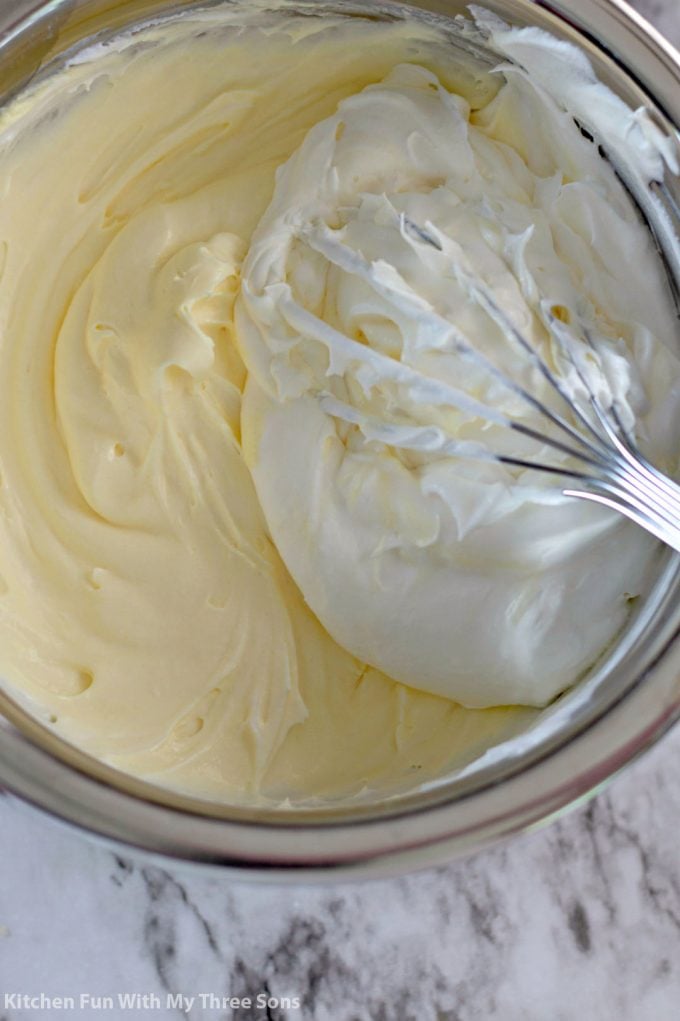 beating together banana pudding and Cool whip to make pastry cream