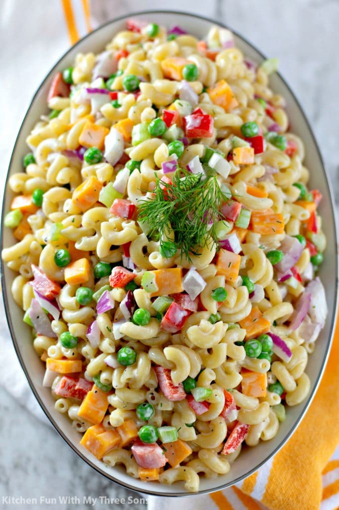 Easy Macaroni Salad Recipe in a white bowl with a white and yellow towel