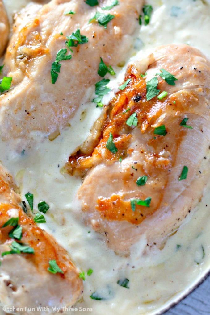 closeup picture of the Garlic Butter Stuffed Chicken in cream sauce