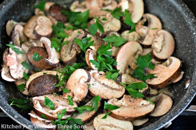 sautéing mushrooms with fresh parsley