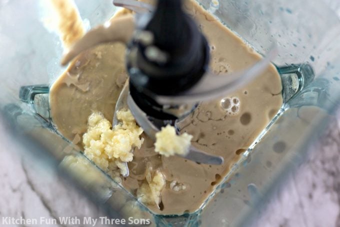 tahini paste, olive oil, and garlic in a blender