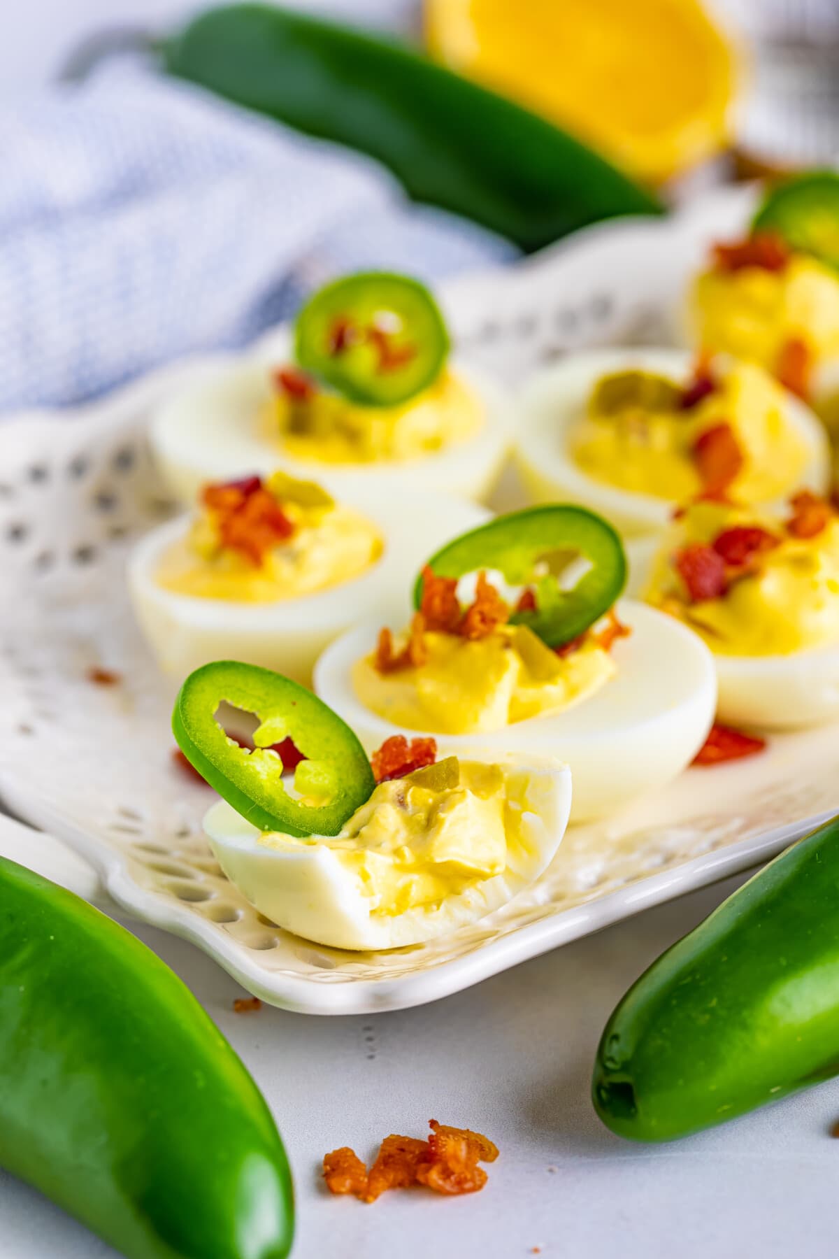 Jalapeno Deviled Eggs with jalapenos on the top.
