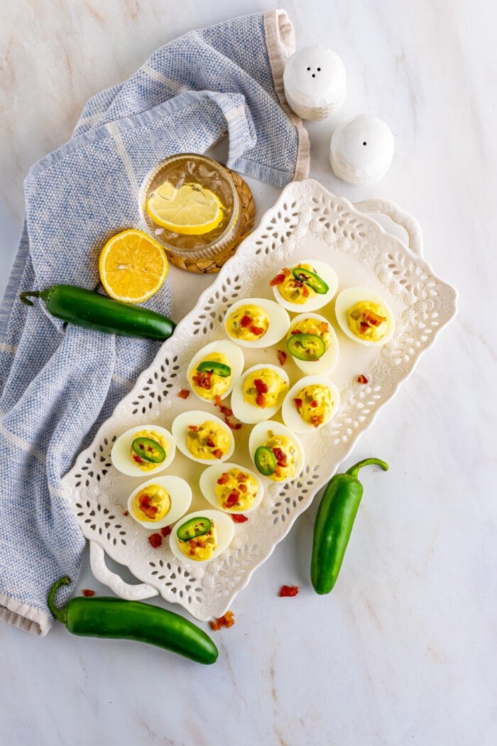 Jalapeno Deviled Eggs on a white tray.