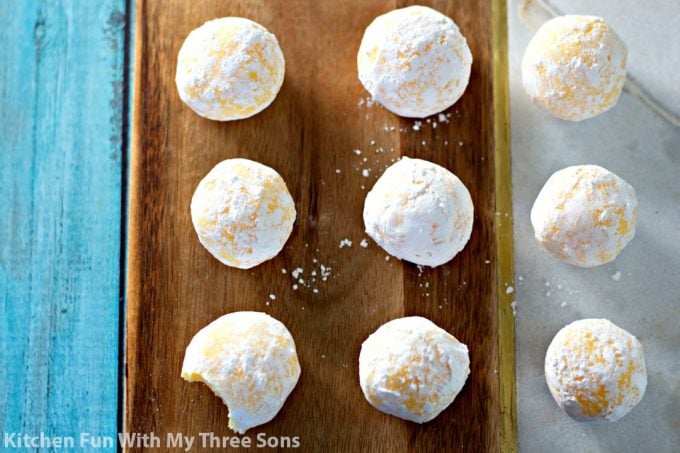 White Chocolate Lemon Truffles on a brown and marble tray