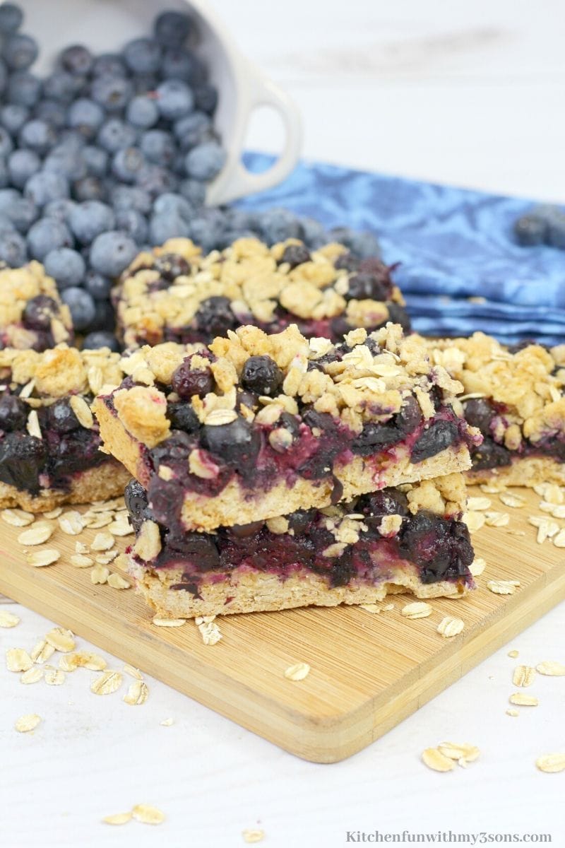 blueberry oatmeal bars on a wooden cutting board