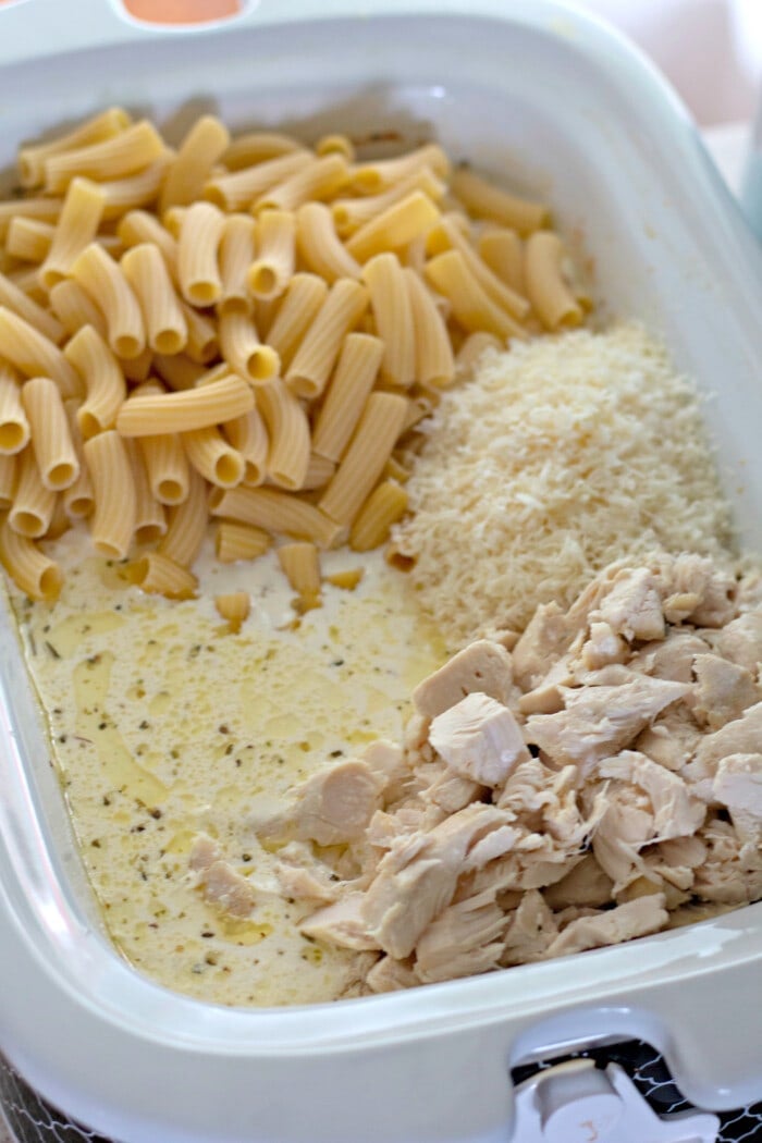 noodles, chicken and sauce ingredients in the slow cooker