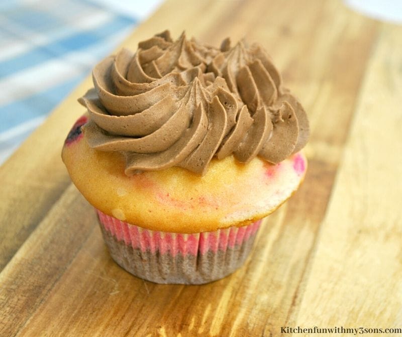 chocolate frosting on the cupcake