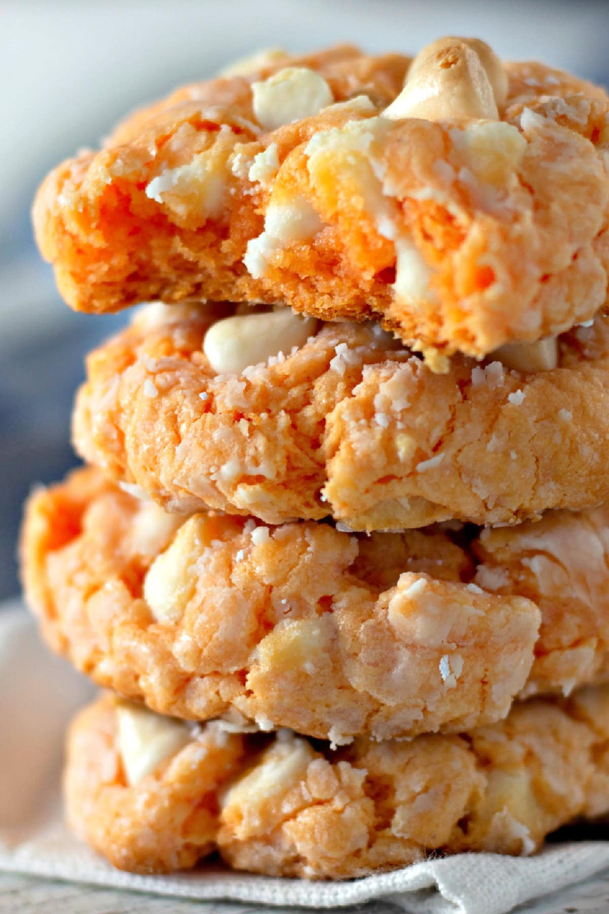 stacked Orange Creamsicle Cookies with a bite taken out