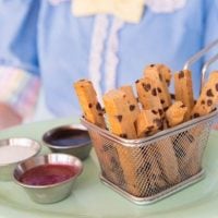 Disney's Plant Based Cookie Fries in a basket on a tray.
