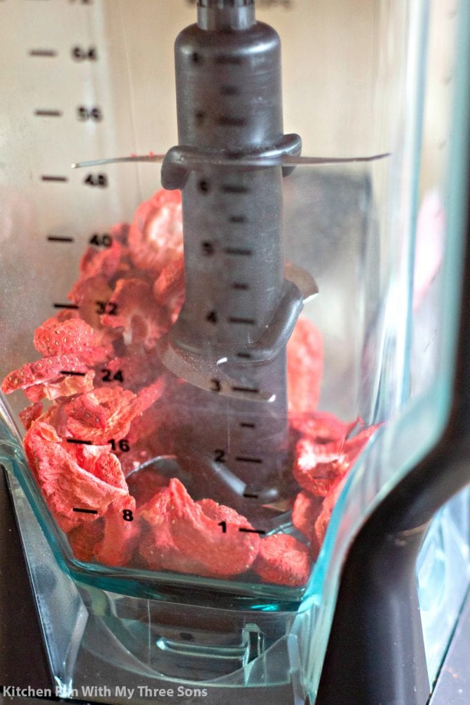 pulsing dried strawberries in a blender