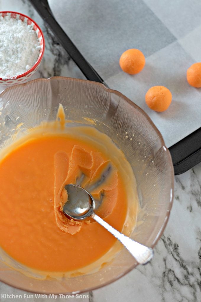 scooping the chilled orange ganache into balls