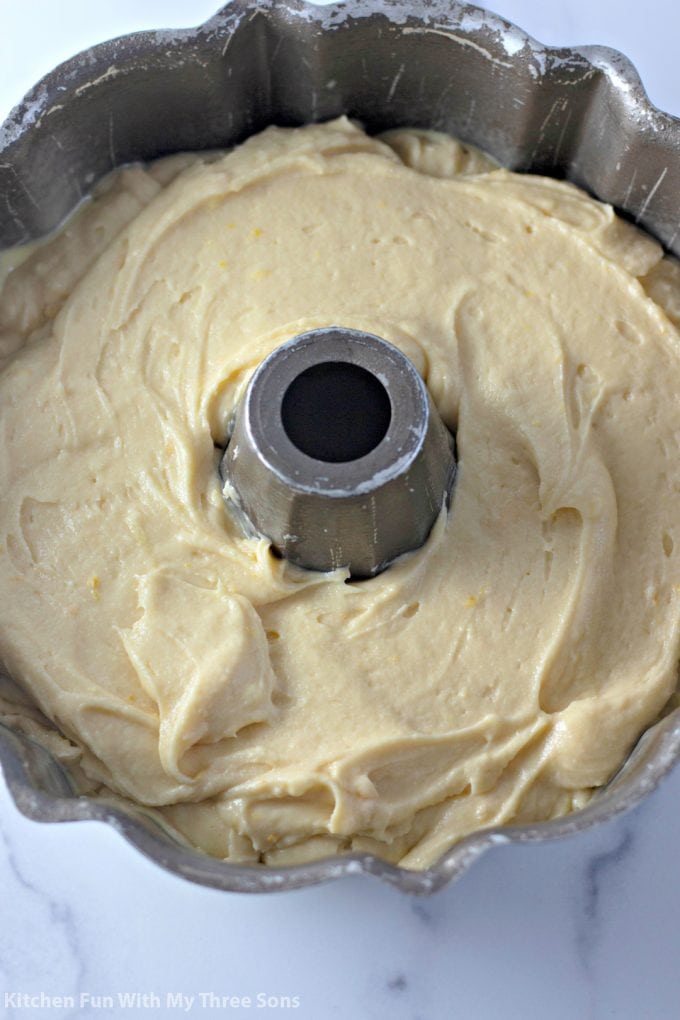 spreading the cake battering into a bundt pan