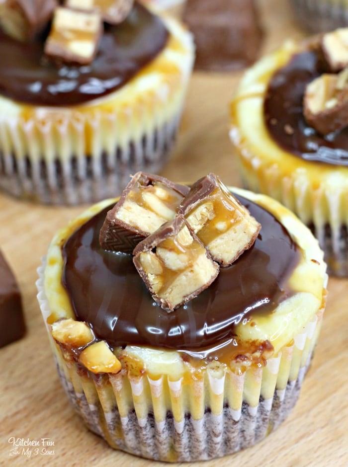 Mini Snickers Caramel Cheesecakes are going to be your new favorite dessert. They have a yummy chocolate cookie layer with salted caramel cheesecake and topped with real Snickers bars.