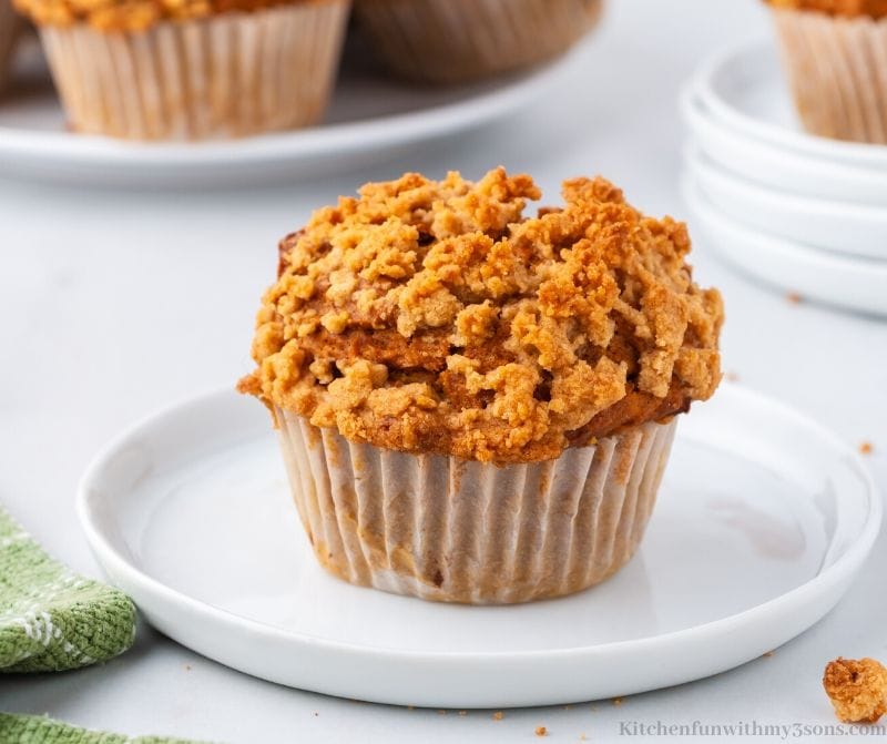 streusel pumpkin spice muffins on a white plate