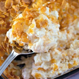 Funeral Potatoes with a large spoon