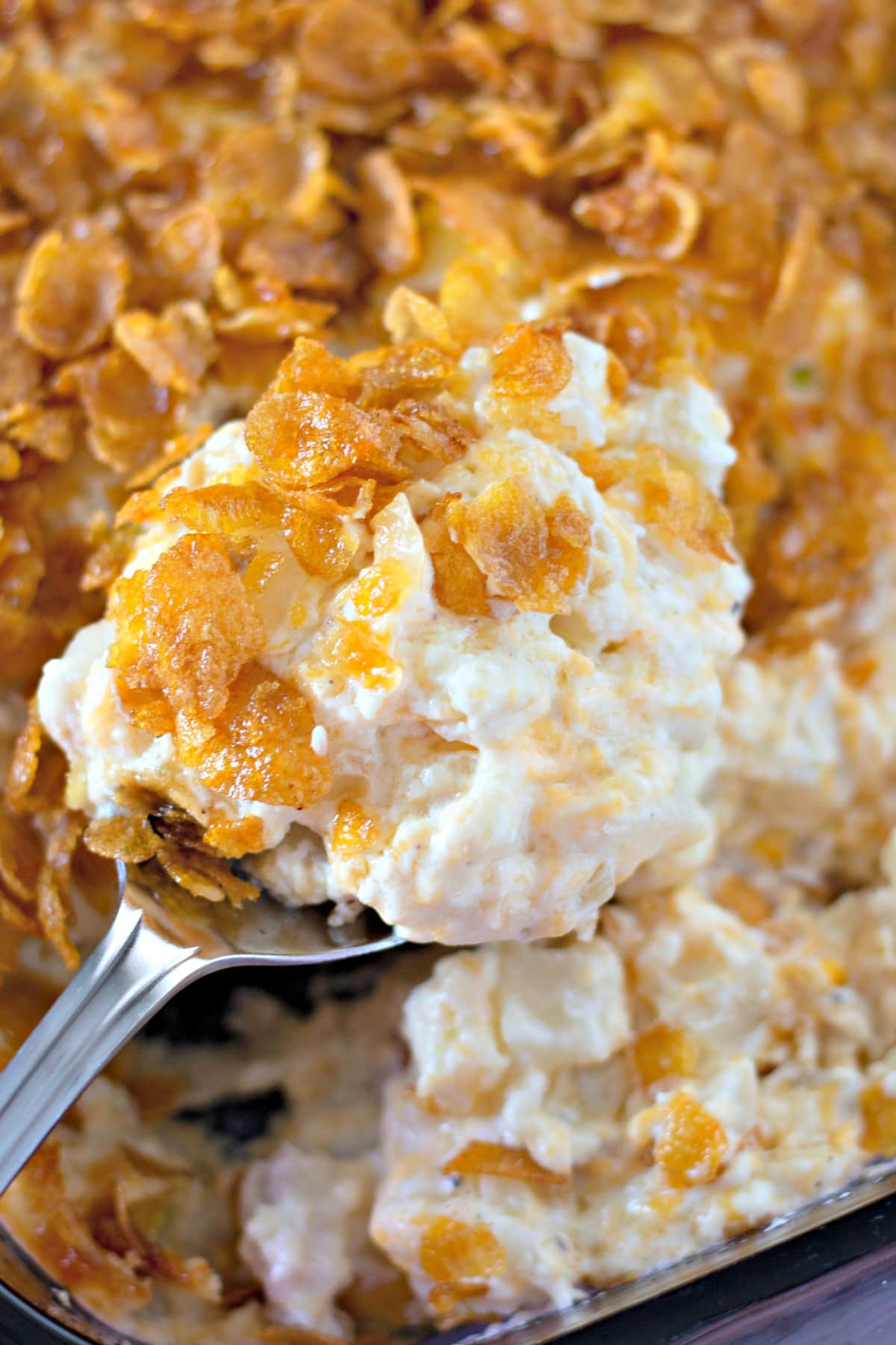 Funeral Potatoes with a large spoon