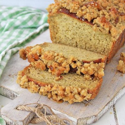 Caramel Apple Banana Bread with Streusel Topping loaf on a board