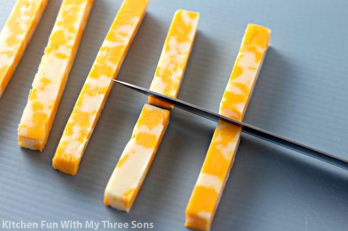 cutting cheese sticks in half