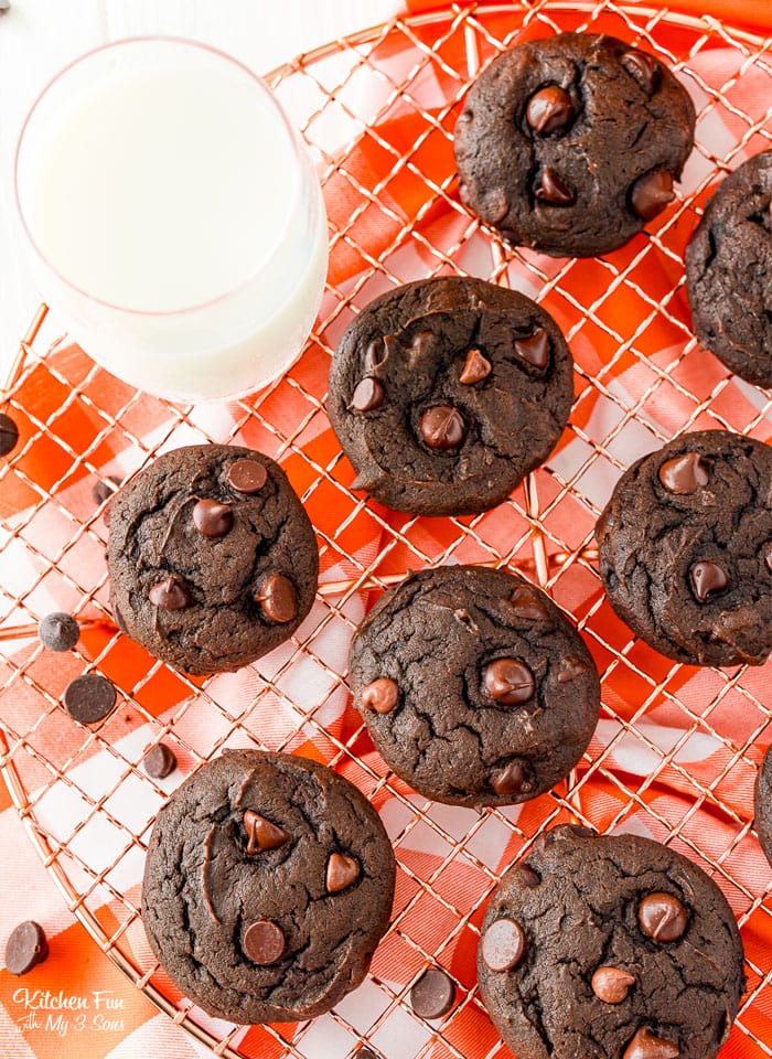 Overhead view of double chocolate pumpkin cookies on a wire cooling rack.