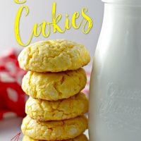 Lemon Cake Mix Cookies in a stack next to a glass of milk.