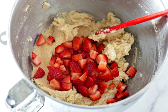 folding strawberries into cookie dough