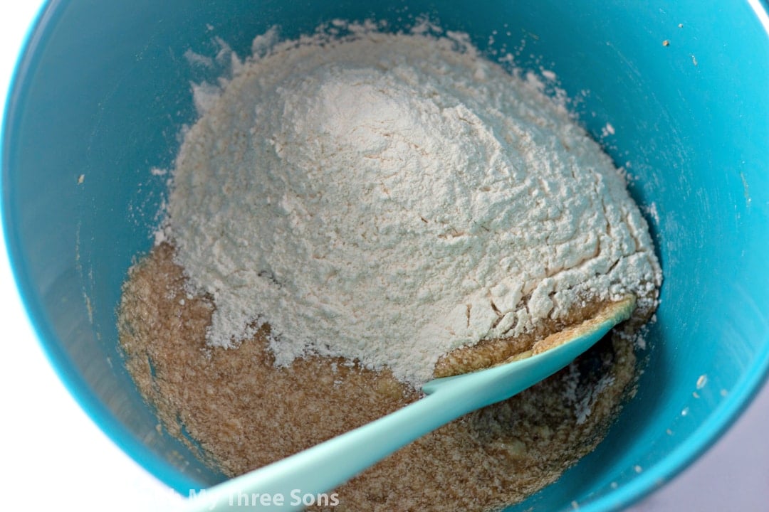 Dry cookie ingredients being added to the wet ones