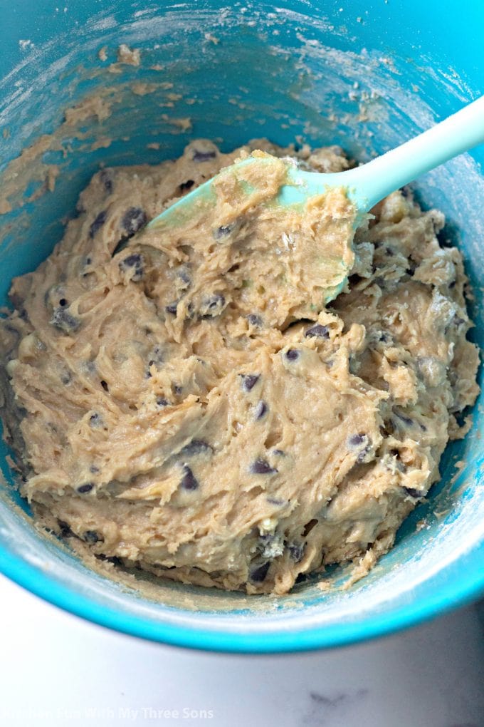 chocolate chip cookie dough in a teal bowl