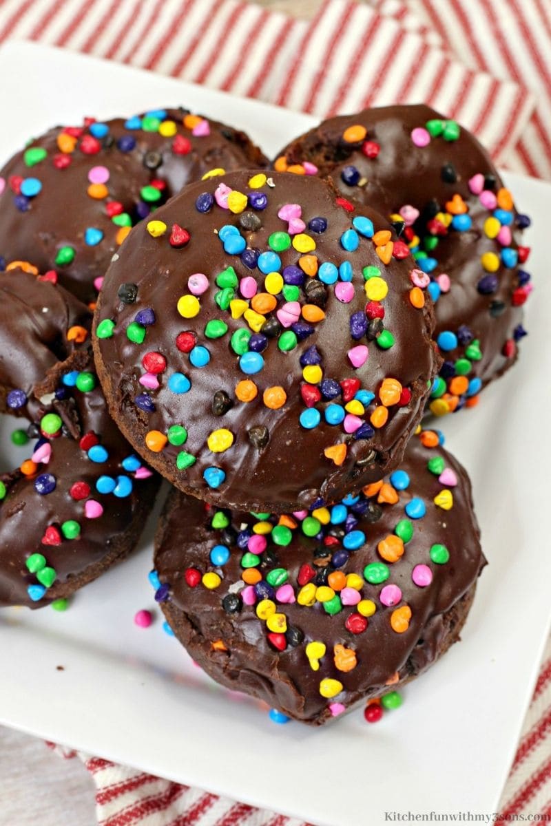 Cosmic Brownie Chocolate Donuts Recipe on a patterned cloth.