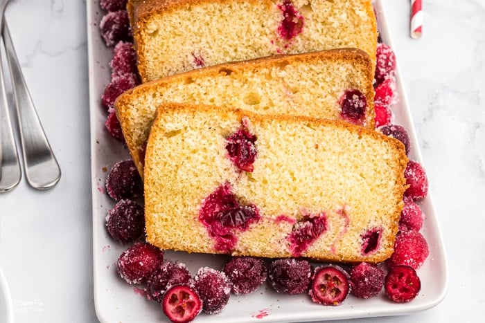 Cranberry Pound Cake is a delicious vanilla pound cake recipe full of fresh cranberries and topped with a creamy homemade icing. 