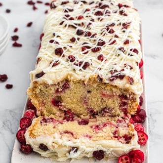 Cranberry Pound Cake is a delicious vanilla pound cake recipe full of fresh cranberries and topped with a creamy homemade icing.
