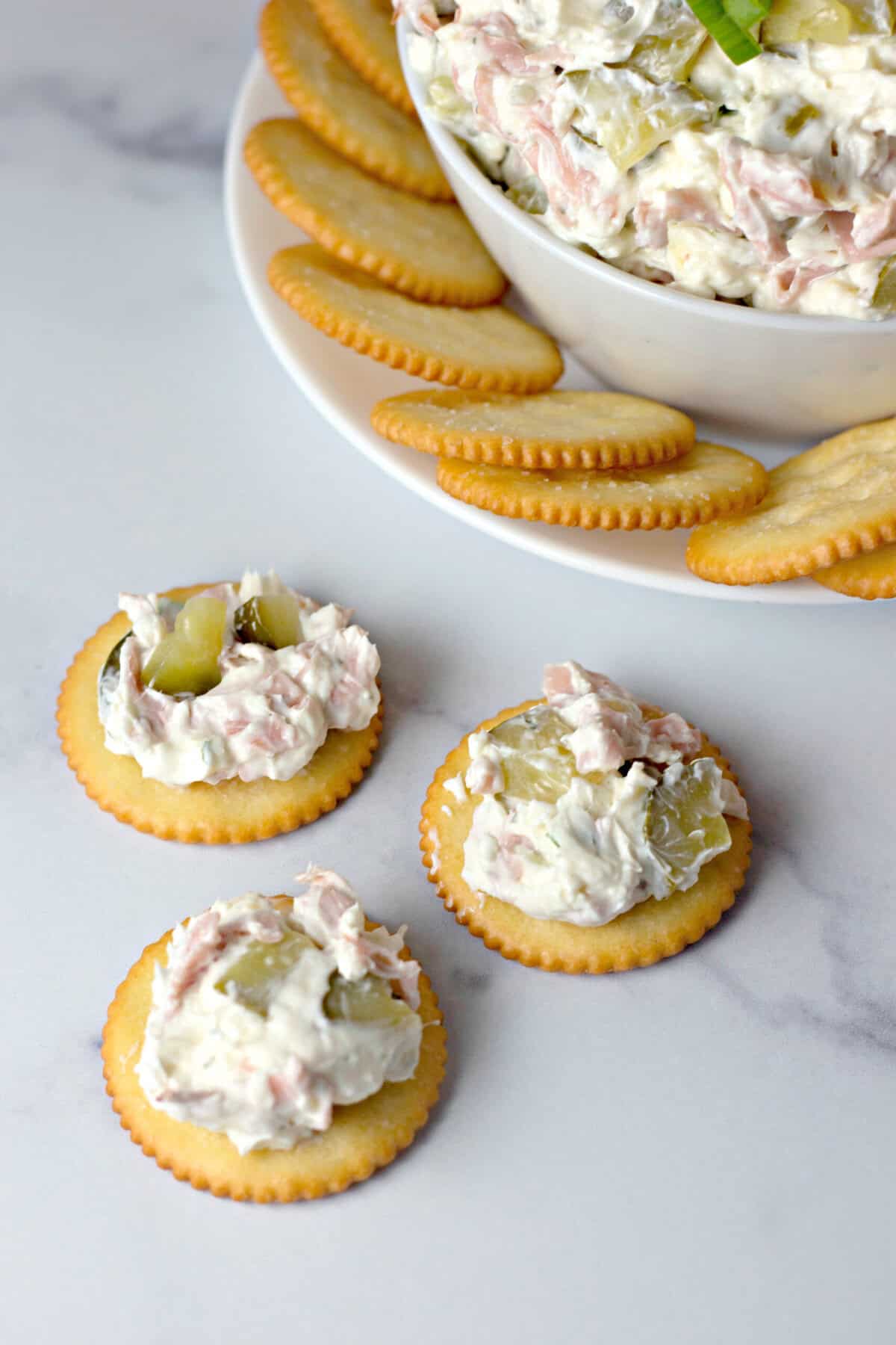 Ritz crackers topped with dill pickle dip