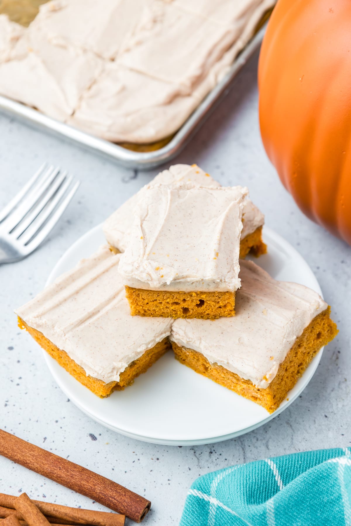 Overhead view of 4 pumpkin bars on a plate