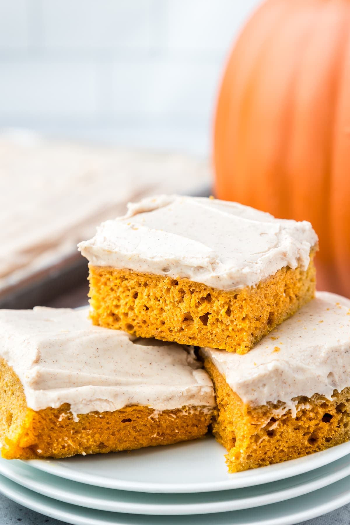 Close up of 3 pumpkin bars on a plate