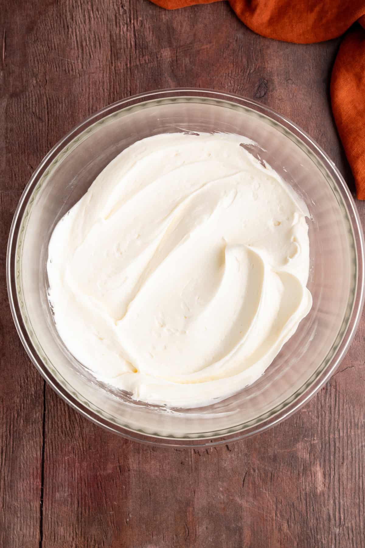 These Pumpkin Bars are soft, incredibly moist and loaded with warm spices. cream cheese frosting in a bowl