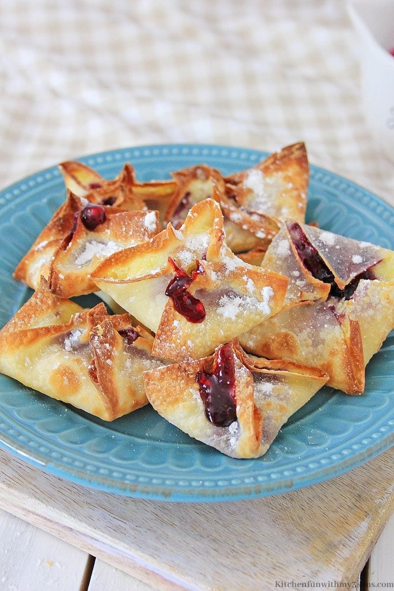 Air Fryer Blueberry Cheesecake Wontons on a blue plate
