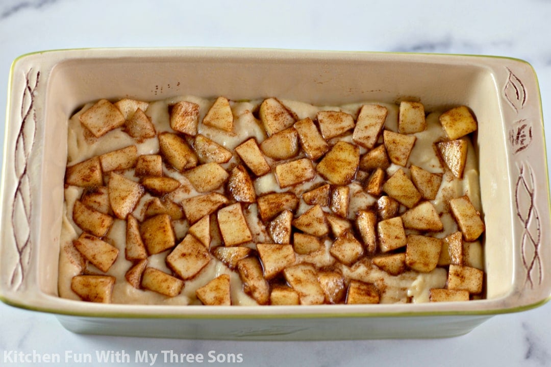pressing apples into the batter