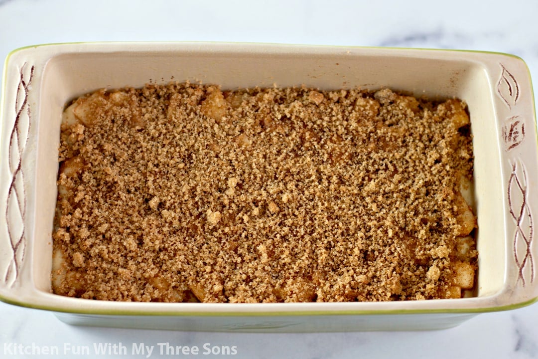 sprinkling brown sugar and cinnamon over the bread