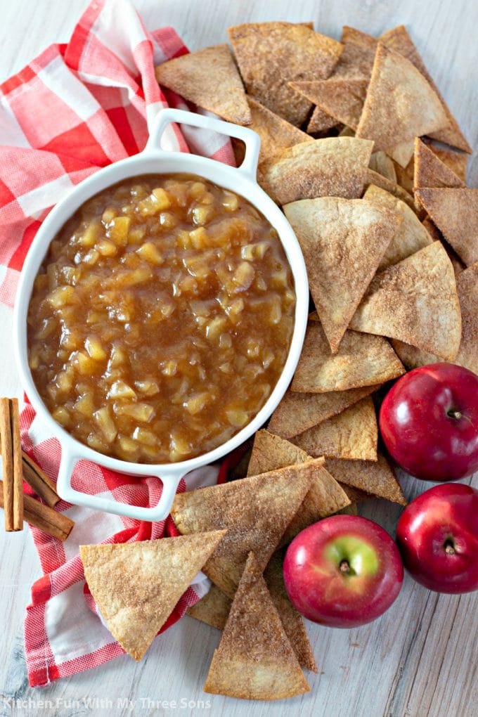 Apple Salsa with Cinnamon Sugar Chips with cinnamon sticks and a red checkered napkin