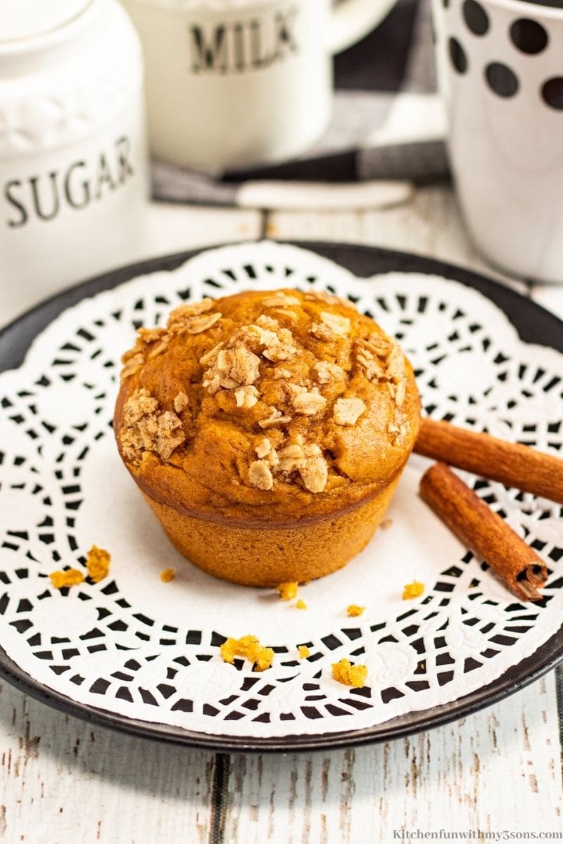 A healthy banana muffin on a white plate