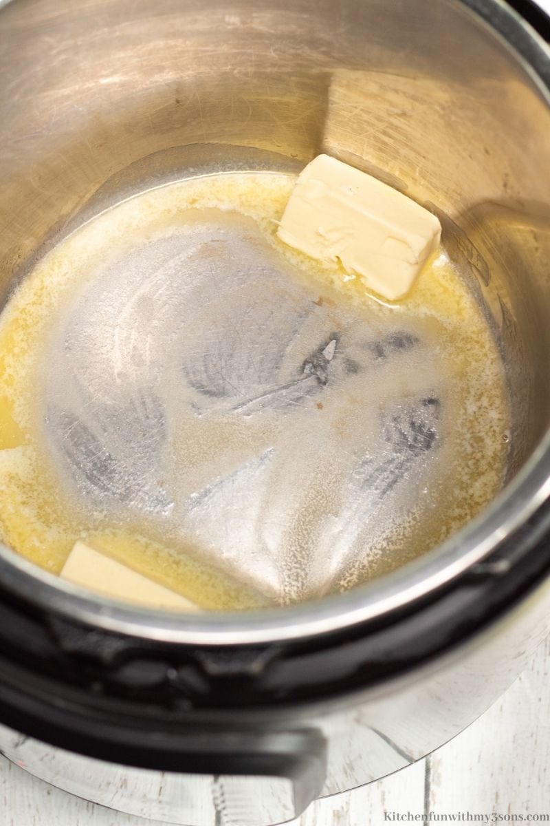 The butter being melted in the Instant Pot.