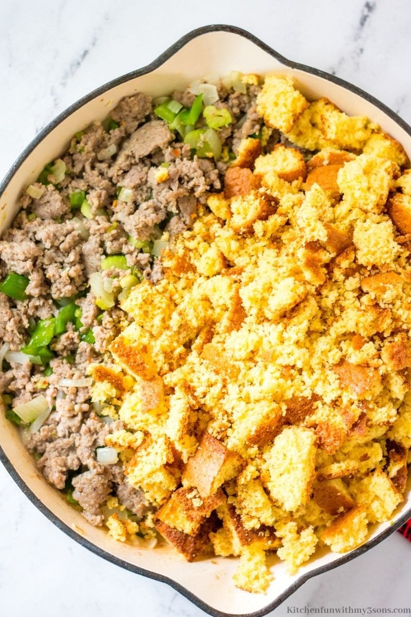 The crumbled cornbread added to the prepared meat and veggies.