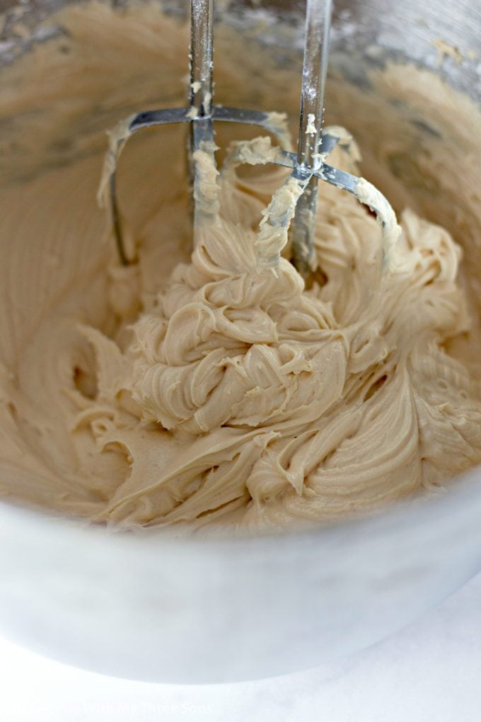 beating peanut butter frosting with an electric mixer